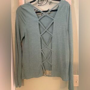 Yoga open back, long sleeve green shirt.